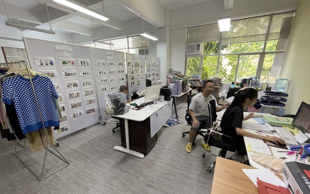 Design room with trend boards and sample rail