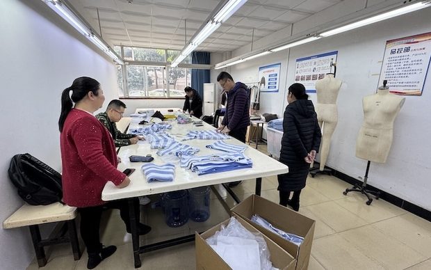 Quality control room with inspection table and dress forms